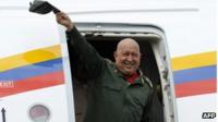 President Hugo Chavez waves from the plane on landing at the airport in Venezuela, on 20 October 2011.