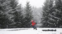 child playing in snow