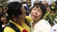 A political prisoner, right, is welcomed by friends as she comes out of Insein prison in Rangoon, Burma, on Friday 13 January 2012