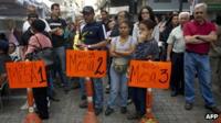 People queue at a polling station in Caracas on 12 February 2012 as Venezuelan opposition parties are voting across the country in their first primary to pick a unity candidate