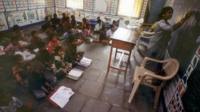 School children sit on the floor in an Indian classroom in a village called Endhal in Gujarat
