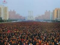 A crowd attends the unveiling of statues of Kim il-Sung and Kim Jong-il in Pyongyang, 13 April