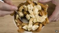 Man eating poutine