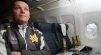 Inspector Andy Marriner from the Metropolitan police looks after the Olympic flame on board Firefly