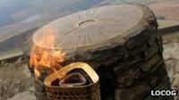 The Olympic torch and on the summit of Snowdon