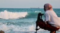 A Somali pirate keeping vigil near Hobyo, in Somalia - Archive shot