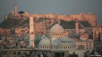 The city of Aleppo with the Old Citadel in the background