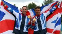 Britain's Tim Baillie and Etienne Stott show off their gold medals