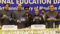Indian president Shri Pranab Mukherjee (fourth from right) holds the new Aakash version 2.0 tablet