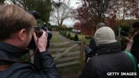 Reporters wait outside a house belonging to former Radio One disc jockey Dave Lee Travis