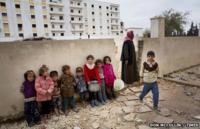 Hungry children search for water in Aleppo (copyright Don McCullin, Times newspaper)