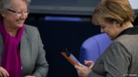 German Chancellor Angela Merkel uses an iPad in the Bundestag