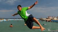 People dive into Dee Why rock pool to beat the heat on January 18, 2013 in Sydney, Australia.