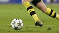 Footballer kicking a ball