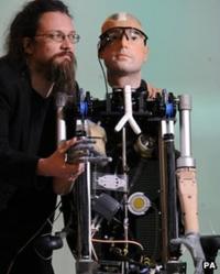 Bionic man with one of the robotics experts who helped build it.