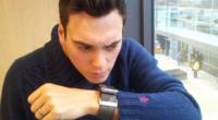 Joe speaking into his watch