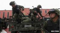 Soldiers get ready for a security operation in Ecatepec, Mexico