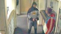 A man dressed as Batman in the police station