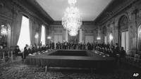 The US delegation, left, and North Vietnamese delegation at Paris peace talks
