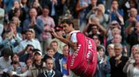 Roger Federer walks off centre court