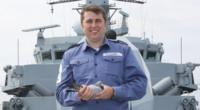 Leading seaman William Hughes with the lost pigeon