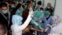 A photo released by Syria's state news agency purportedly showing victims of a chemical weapons attack at Khan al-Assal (19 March 2013)