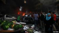 A woman cries at the site of an explosion in Beirut's southern suburb