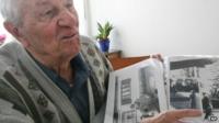 Rochus Misch points on a picture of Adolf Hitler he had taken in Berchtesgarden, southern Germany - 2005