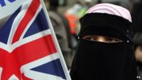 Woman wearing a veil with a Union Jack