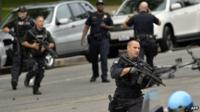 Heavily armed police respond to the scene