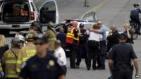 Police gathered near the scene of the shooting incident on Capitol Hill