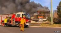 Firefighters from New South Wales Rural Fire Service (RFS) arrive to put out a fire at a property in Lithgow, New South Wales