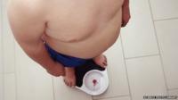 Obese child on scales