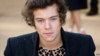 Harry Styles in a leopard print t-shirt