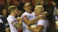 England team hug after winning