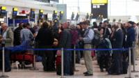 Passengers queuing at Heathrow airport
