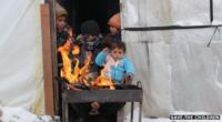 Refugees in a makeshift shelter