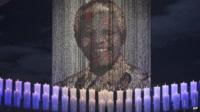Mandela's picture in front of candles
