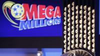 Lottery machine and mega millions logo