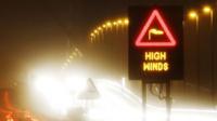 A road sign which says 'high winds'