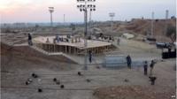 Pakistani workers prepare a stage around the ancient ruins, ahead of the Sindh Festival opening ceremony in Mohenjo Daro