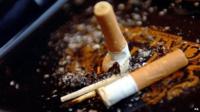 Cigarettes stubbed out in an ash try