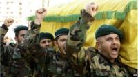 Hezbollah fighters at the funeral of a commander killed in Syria