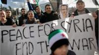 Demonstrators in Geneva, Switzerland, call for an end to the Syrian war