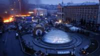 aerial of main square in Kiev with fire and smoke