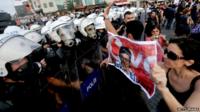 Protester holds picture of Berkin Elvan (July 2013)