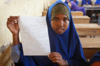 Zahra holds up her letter