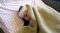 Handout picture released by Syrian state news agency Sana shows injured child in Hama (1 May)