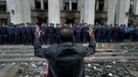 Man gestures at site of Odessa fire, 3 May