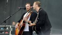 Kings of Leon were joined by Chris Martin on stage